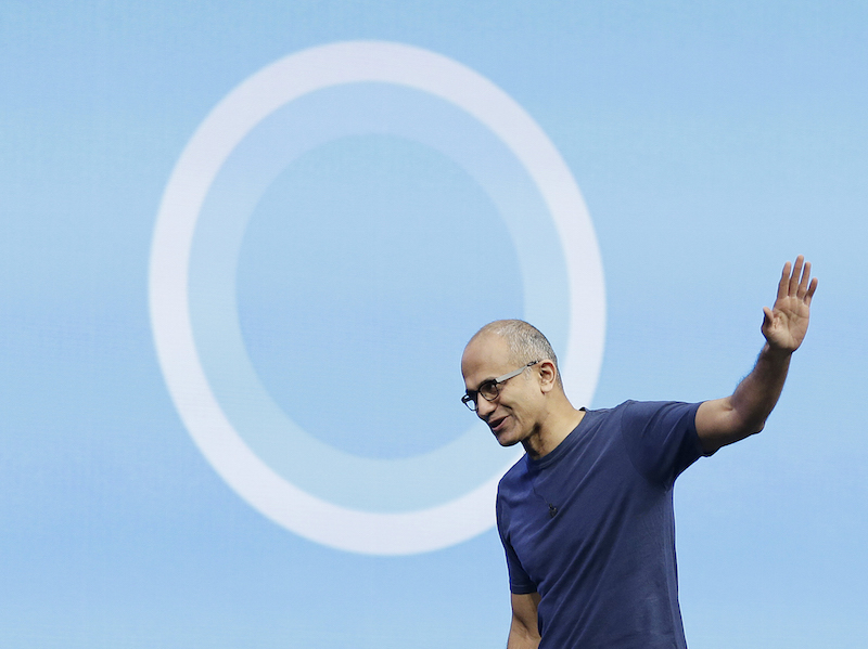 Microsoft CEO Satya Nadella waves after delivering the keynote address to the Build Conference Wednesday, April 2, 2014, in San Francisco. Microsoft kicked off its annual Build conference for software developers, with new updates to the Windows 8 operating system and upcoming features for Windows Phone and Xbox. (AP Photo/Eric Risberg)