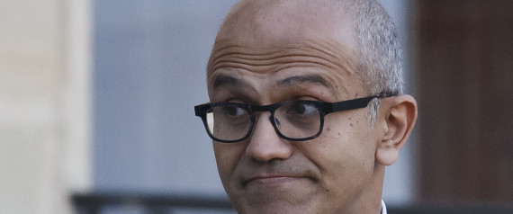 Microsoft CEO Satya Nadella looks back to the media as he leaves the Elysee Palace after a meeting with France's President Francois Hollande in Paris, France, Monday, Nov. 9, 2015. Satya Nadella will meet students later to discuss economic opportunities in the digital age. (AP Photo/Michel Euler)